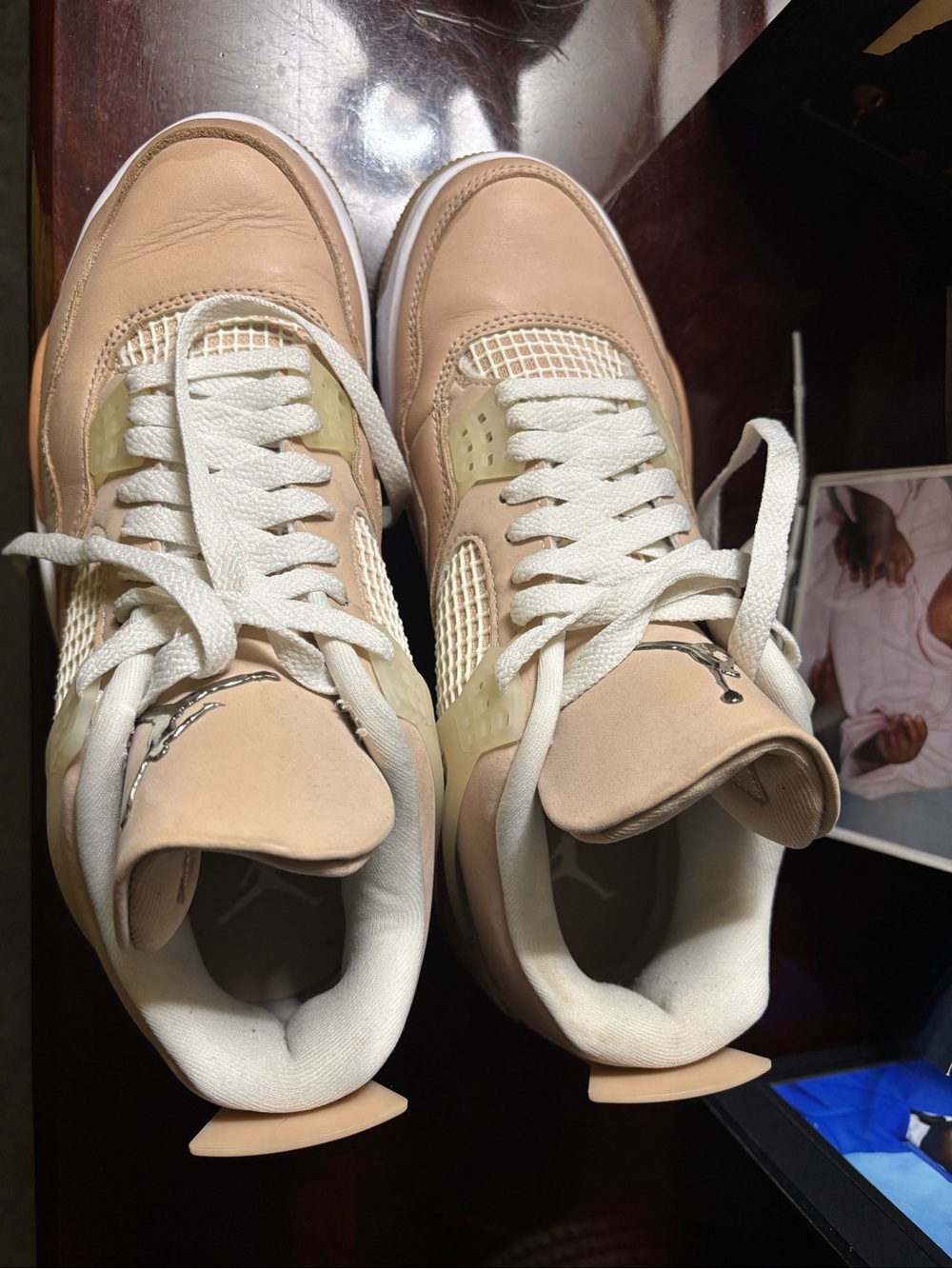 Nike Women’s Air Jordan 4 Sneakers in Beige and White